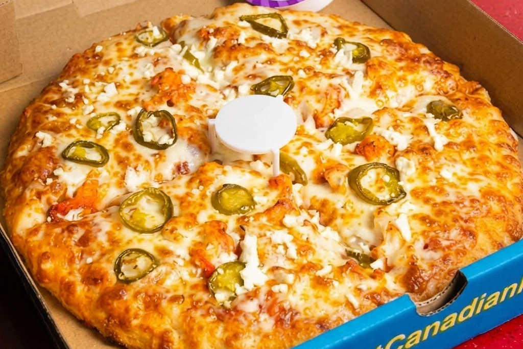 House Special Pizza with tandoori chicken and feta at Great Canadian Pizza & Fried Chicken Calgary